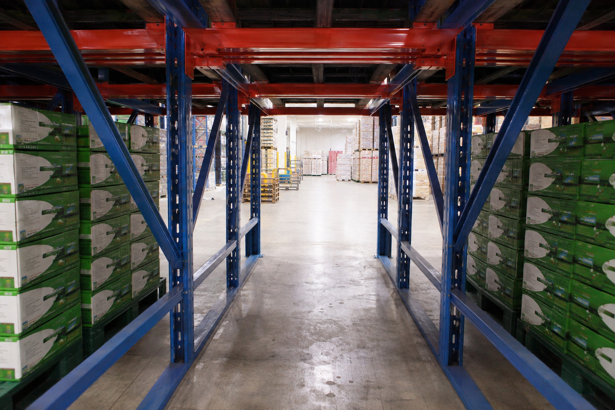 Warehouse Commercial Industrial drive-in pallet racking inside lane outward green cartons racknsave Singapore