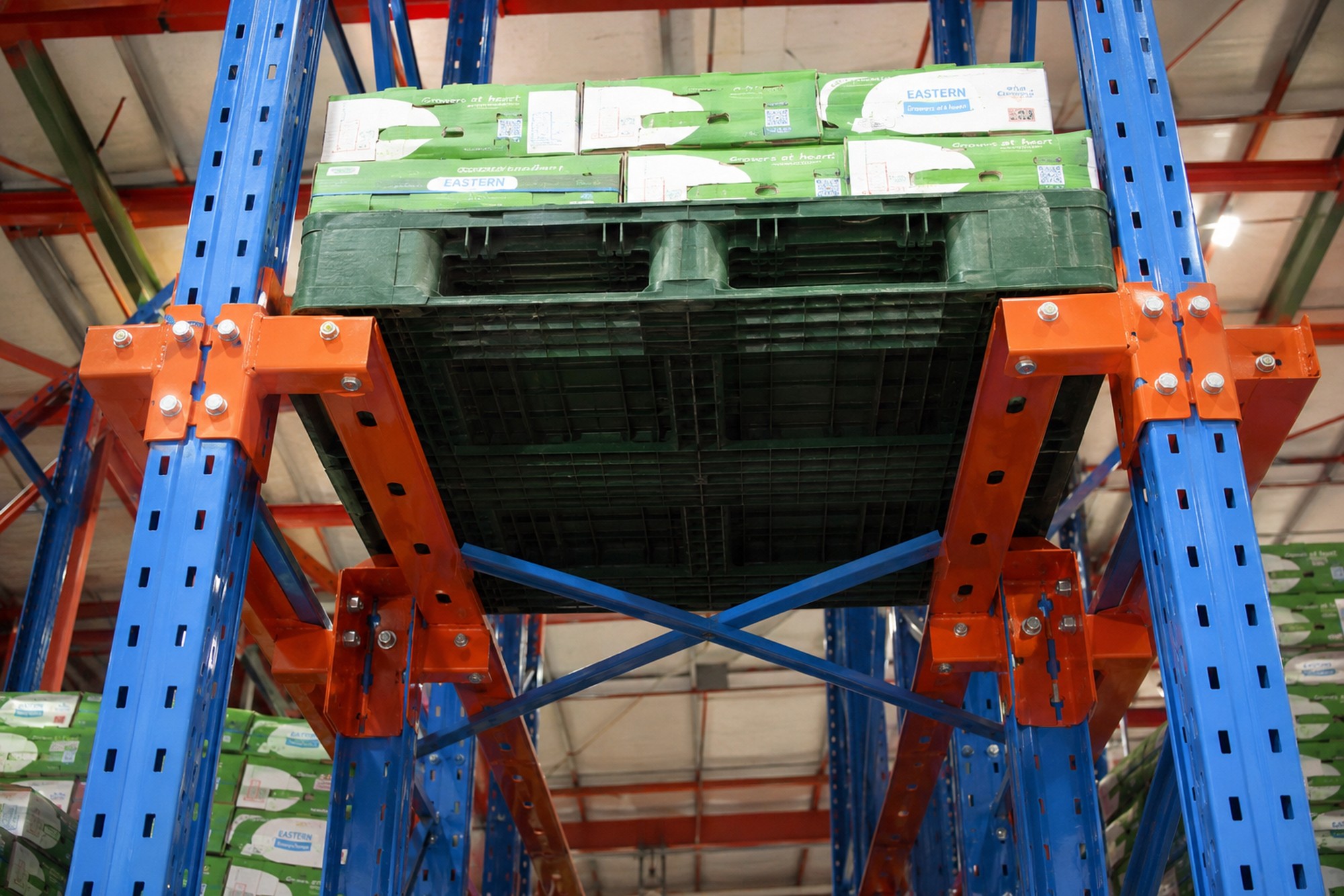 Warehouse Commercial Industrial drive-in pallet racking pallet underside rails green cartons racknsave Singapore