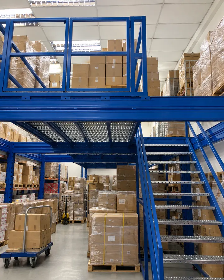 Import export mezzanine illustration showing upper-floor reserve cartons and boxes with warehouse operations below.