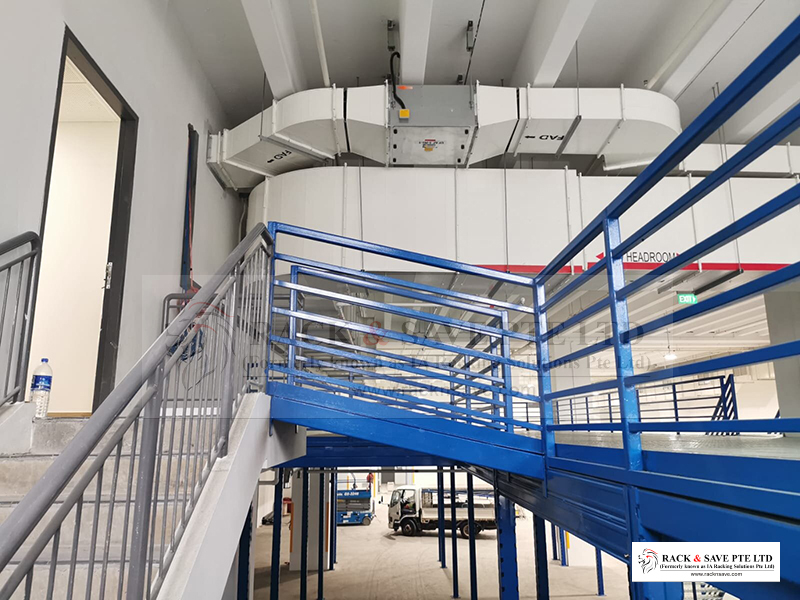 Linkway or link bridge from mezzanine to existing staircase, installing mezzanine on Tuas Singapore project - Racknsave Racking Solutions.